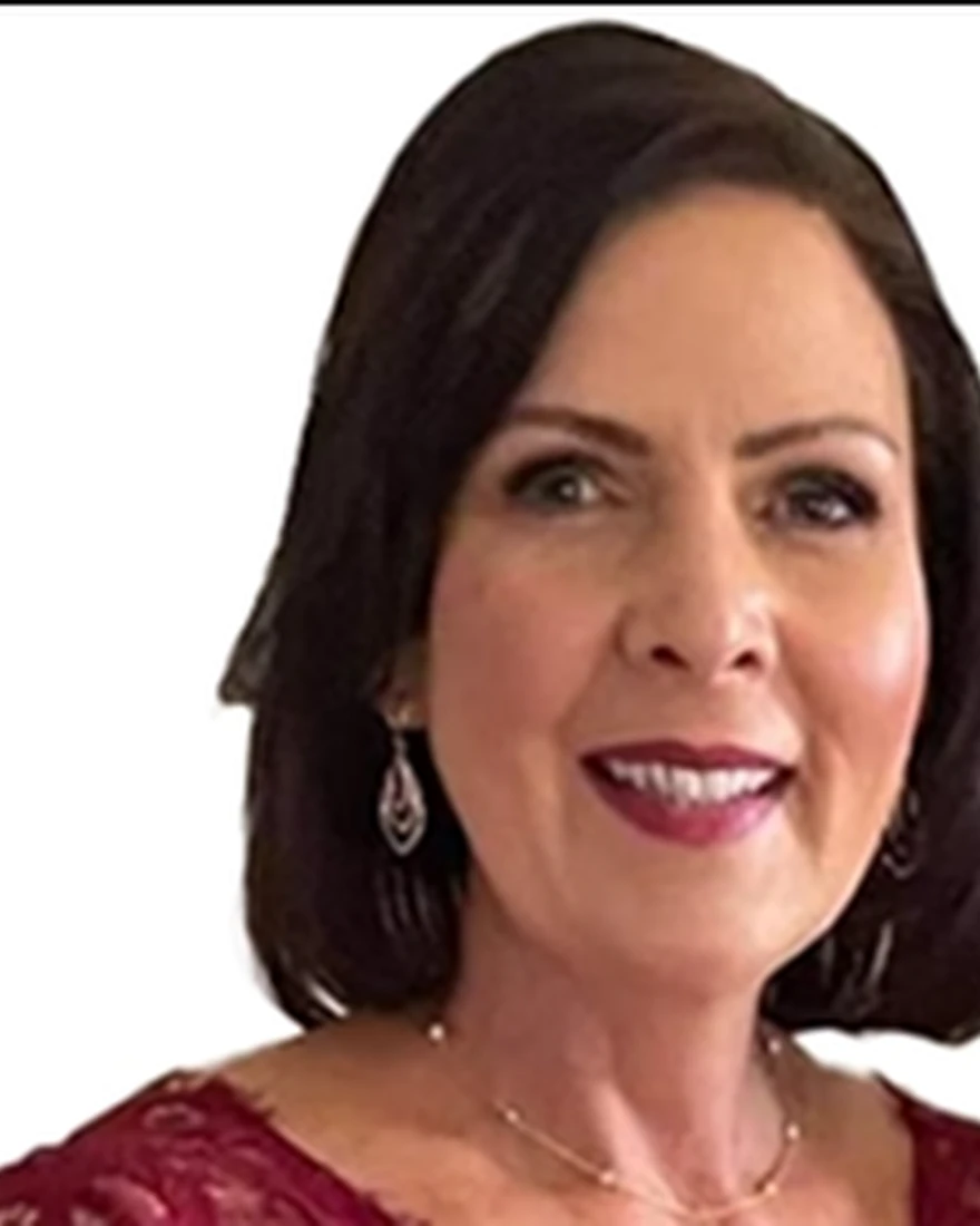 Suzanne Martin, an instructional designer and resource writer, smiles at the camera.
